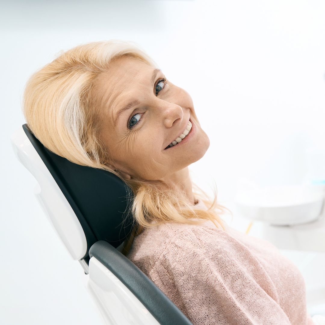 Portrait of beautiful patient looking at camera with charming smile and waiting for procedure